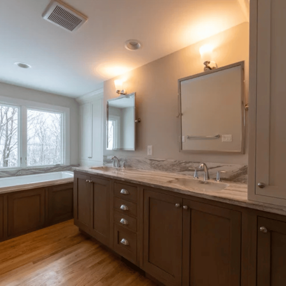Experienced general contractor in Western Montana reviewing architectural plans for a high-end residential remodel